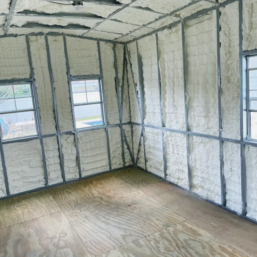 Closed-cell spray foam insulation applied to wall cavities in a residential project in Beaver Dam
